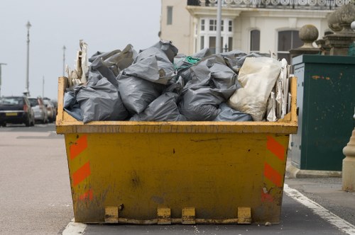 Photo of a delivery van near a skip, showing safe placement and accessible access point